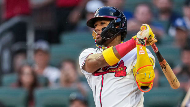 Aug 23, 2023; Cumberland, Georgia, USA; Atlanta Braves right fielder Ronald Acuna Jr. (13) gets an infield single against the New York Mets during the second inning at Truist Park. Mandatory Credit: Dale Zanine-USA TODAY Sports  